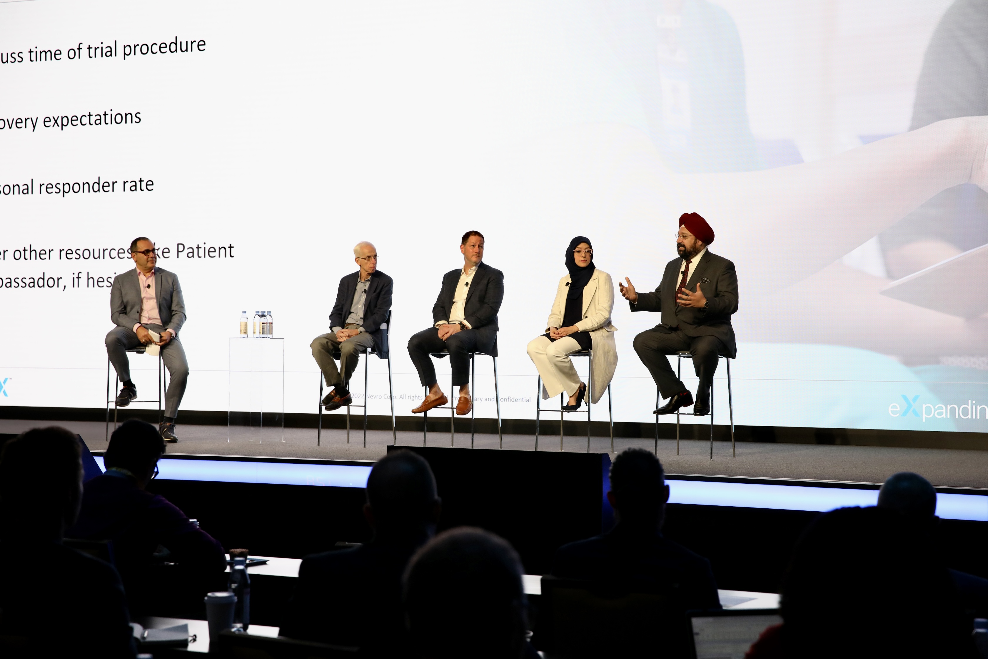 A panel discussion produced by Convene Medical, five experts on stage with an engaged audience